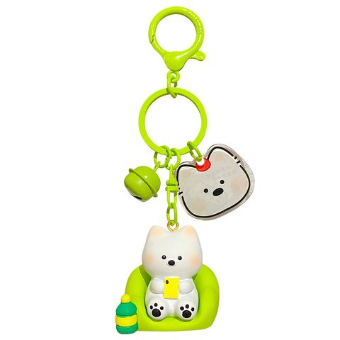 Binge-watching mode keychain charm on white background