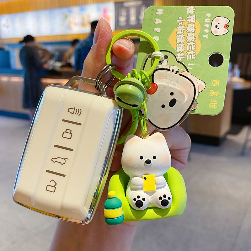 Binge-watching mode keychain charm attached to a car key fob