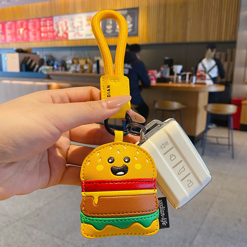 Burger keychain charm attached to a car key fob