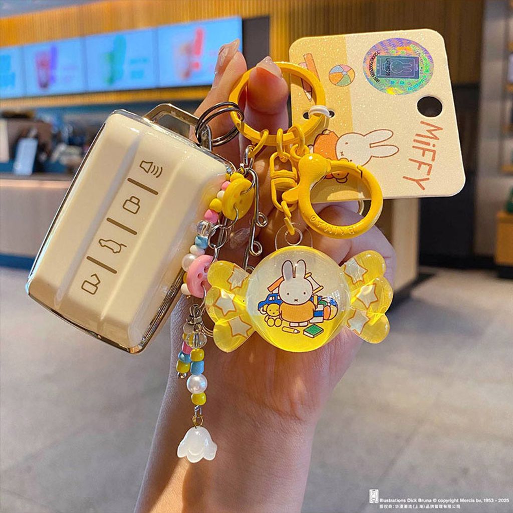 Miffy bunny candy keychain charm in yellow attached to car keys