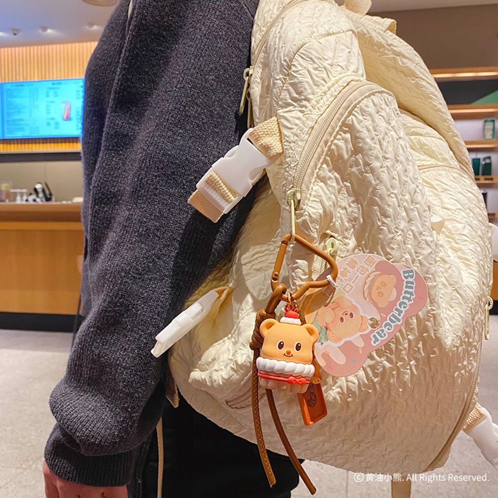 Butterbear foodie keychain charm cupcake design hanging on bag