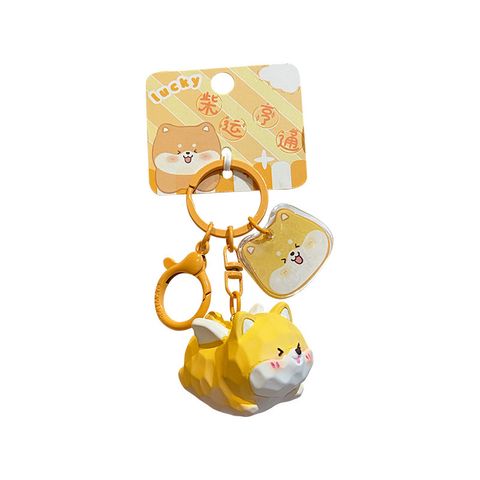 Flying Shiba Inu keychain charm on white background