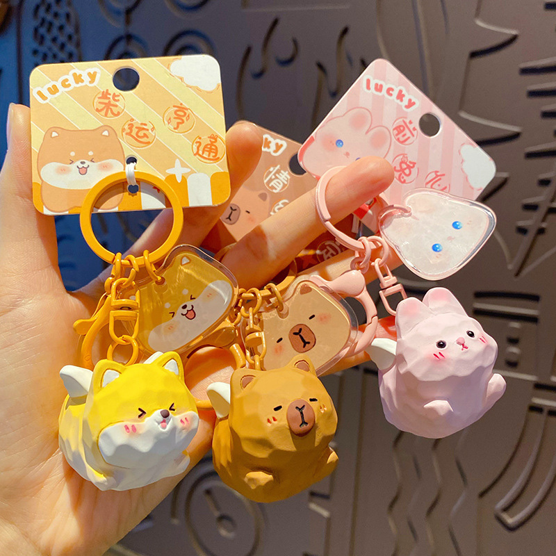 Cute pet paradise flying keychain charms showing multiple designs