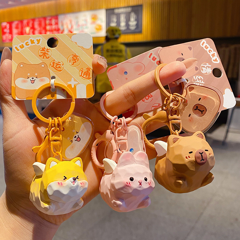Cute pet paradise flying keychain charms showing multiple designs