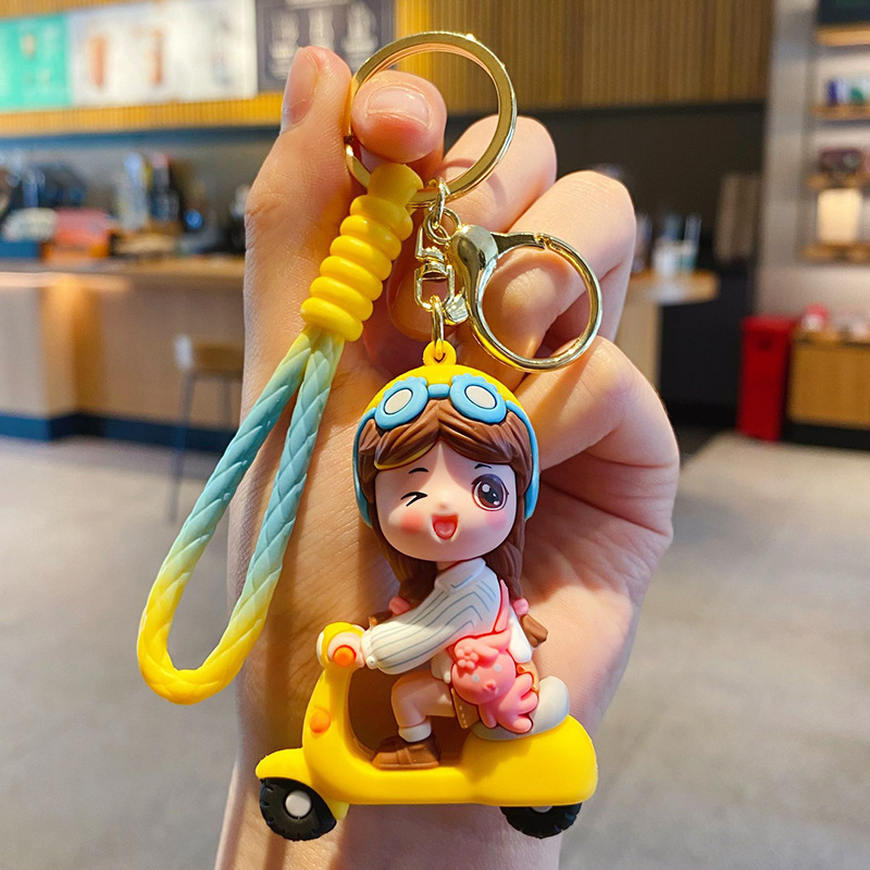 Electric scooter girl keychain charm in yellow