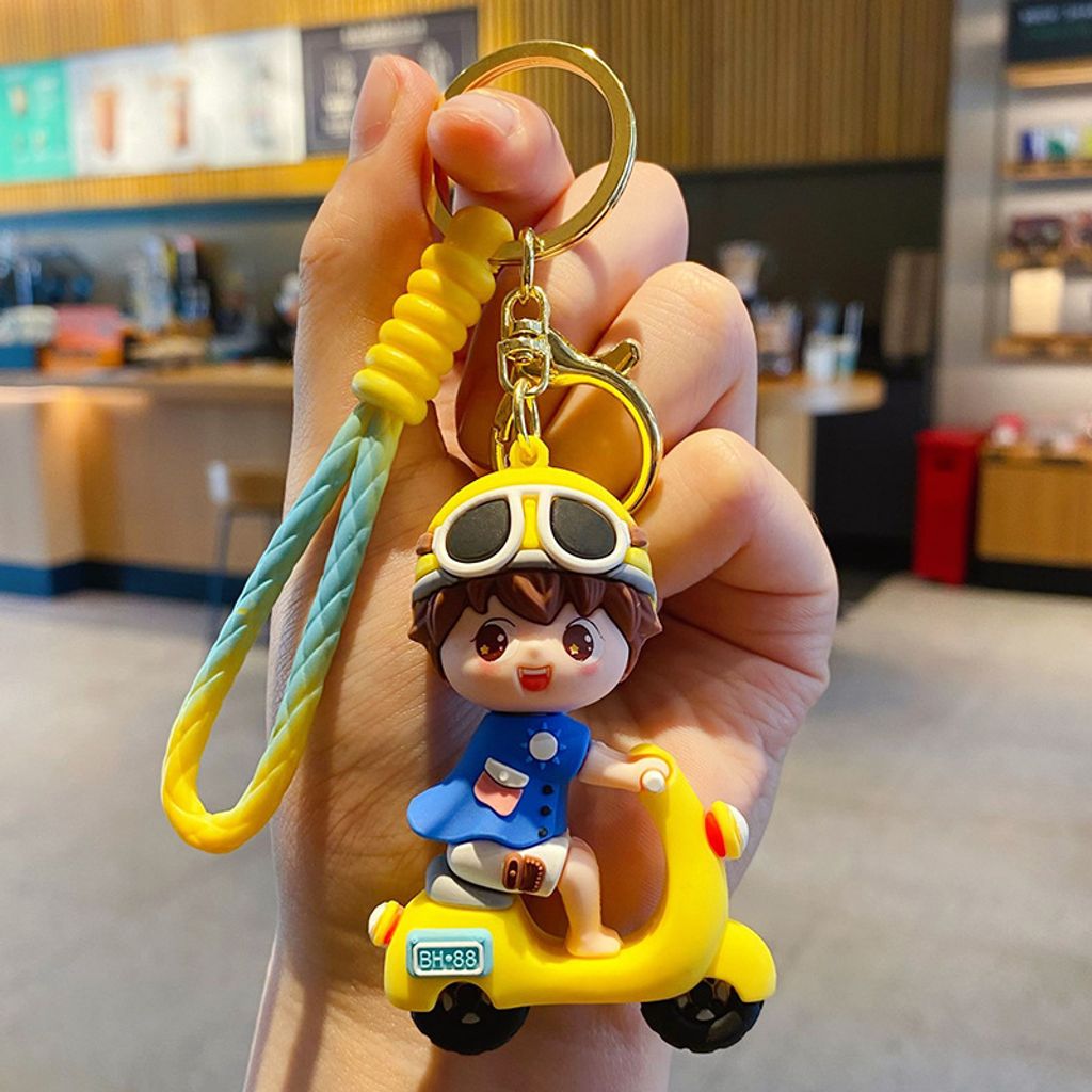 Electric scooter boy keychain charm in yellow