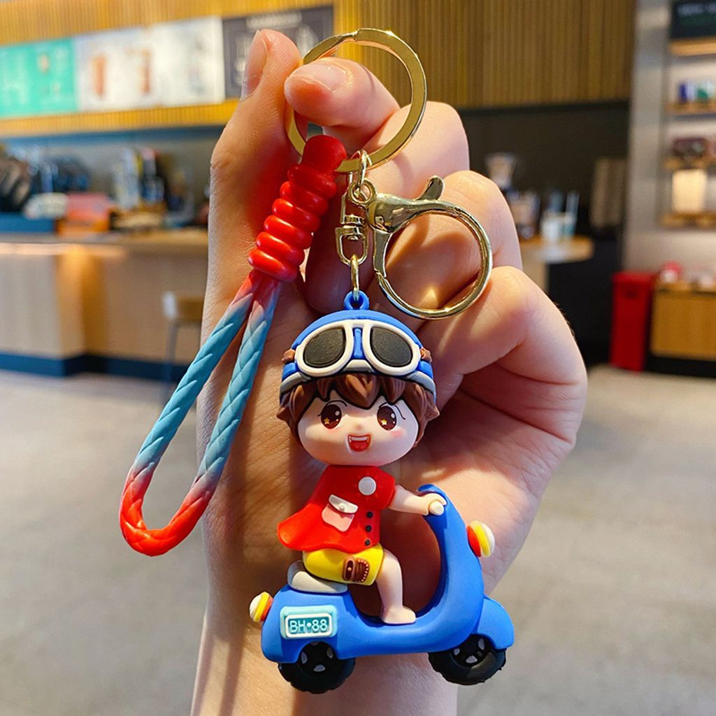 Electric scooter boy keychain charm in blue