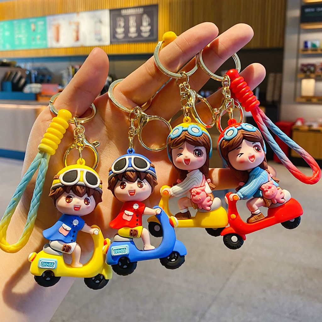 Electric scooter boy and girl keychain charms featuring all four designs