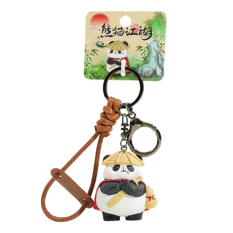 Panda hero keychain charm on white background