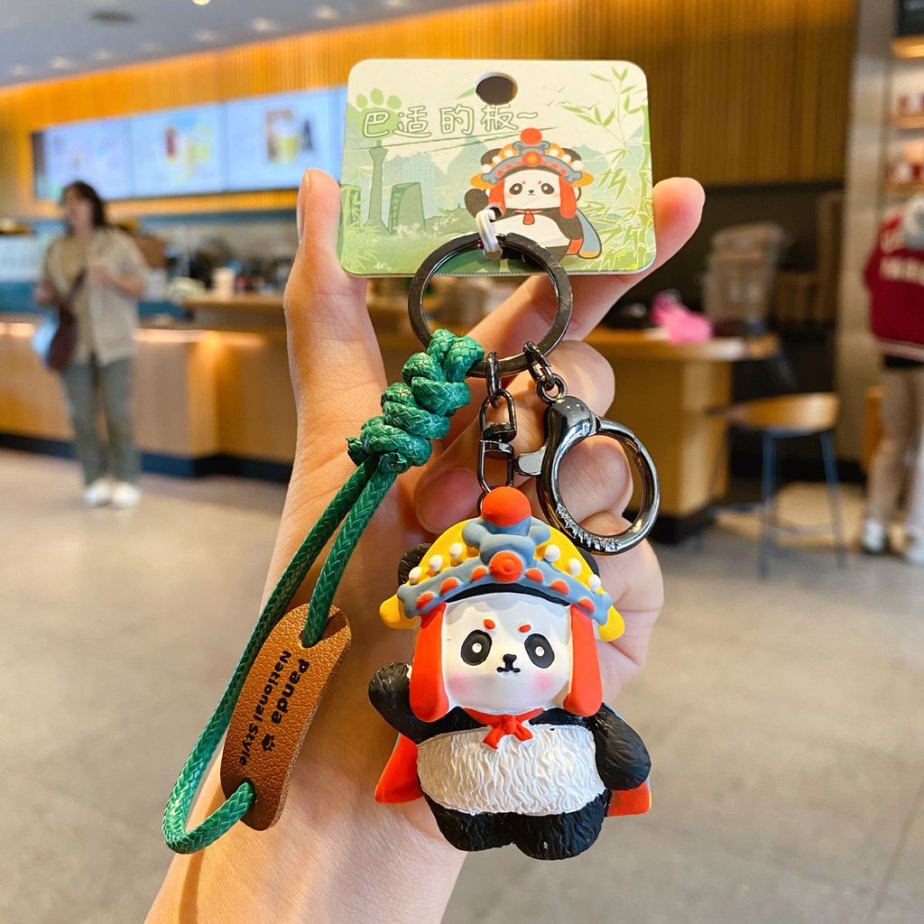 Face-changing panda keychain charm