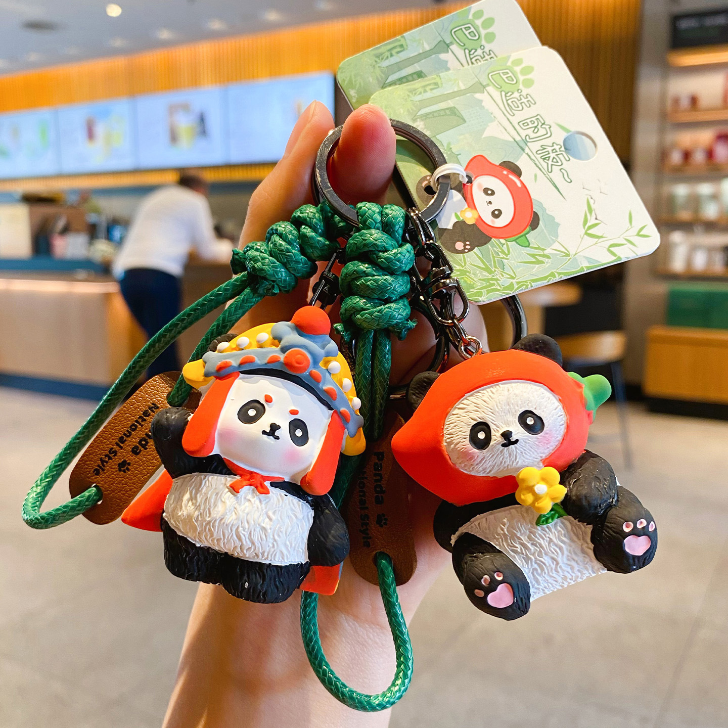 Face-changing panda and spicy girl panda keychain charms