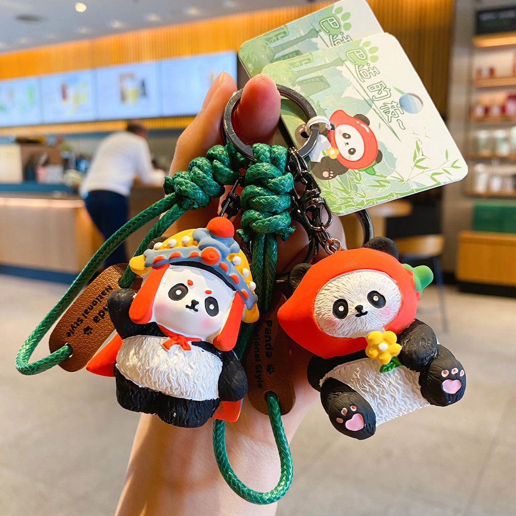 Face-changing panda and spicy girl panda keychain charms