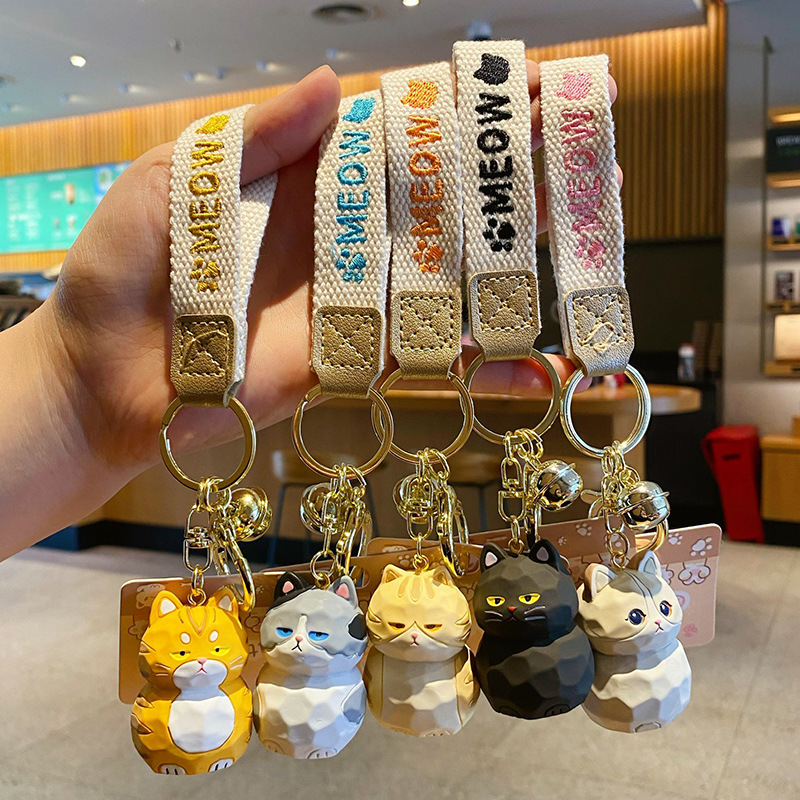 Cute cat family wood carving style keychain charms featuring all five designs