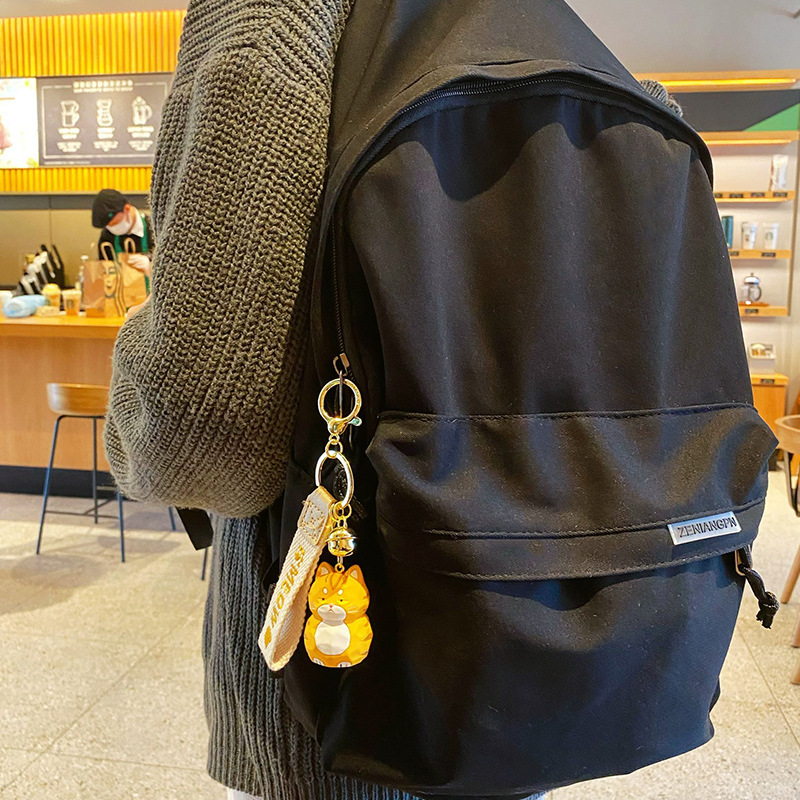 Bengal cat keychain charm hanging on a bag