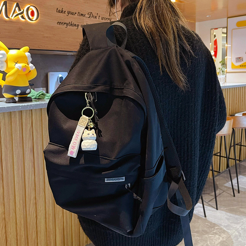 Ragdoll cat keychain charm hanging on a bag