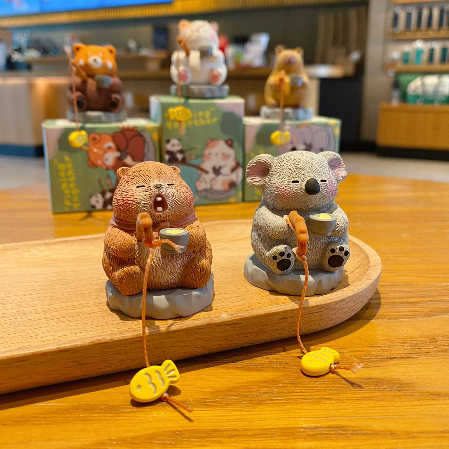 Groundhog fishing and koala fishing mini figurines