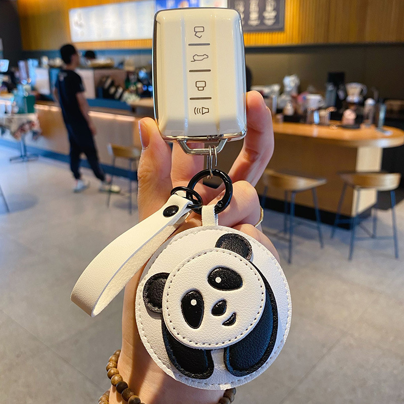 Panda keychain charm attached to a car key fob