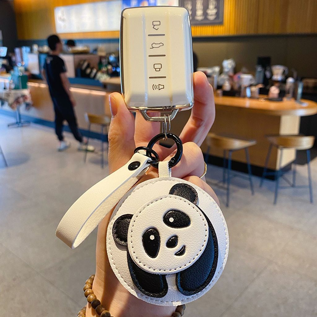 Panda keychain charm attached to a car key fob