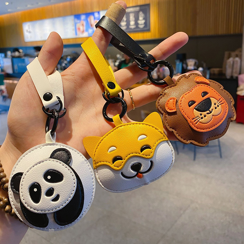 Cute panda, Shiba Inu, and lion keychain charms featuring all three designs
