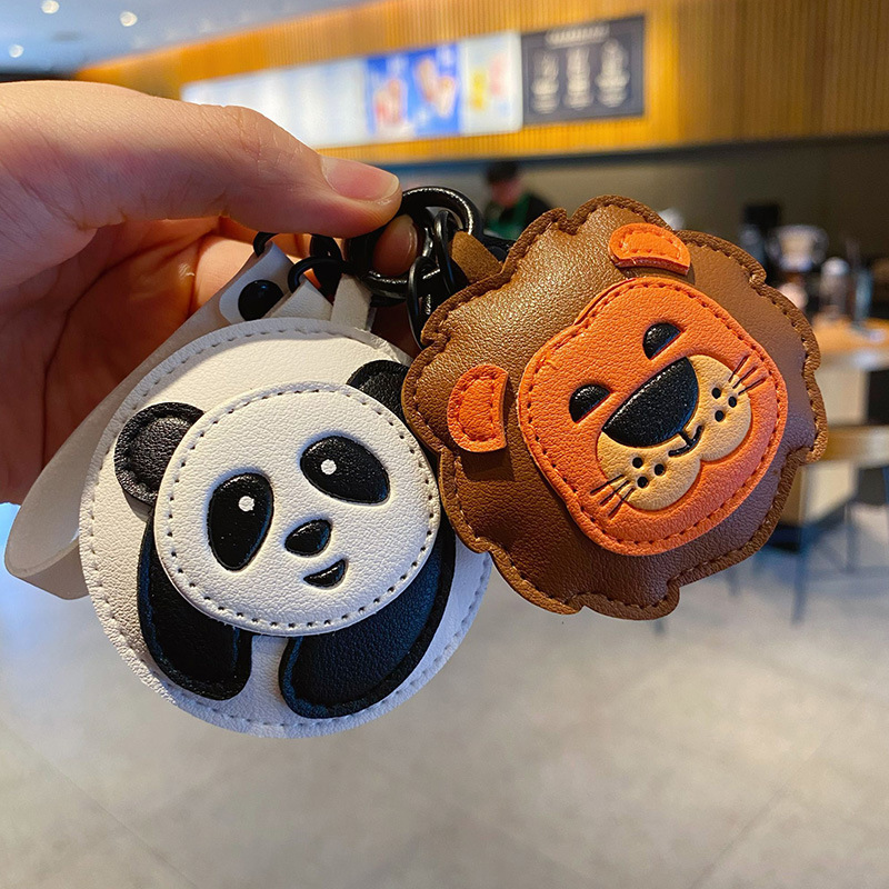 Panda and lion keychain charms