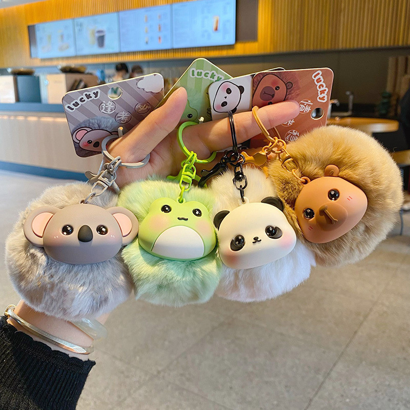 Cute fluffy animal pom pom keychain charms showing multiple designs