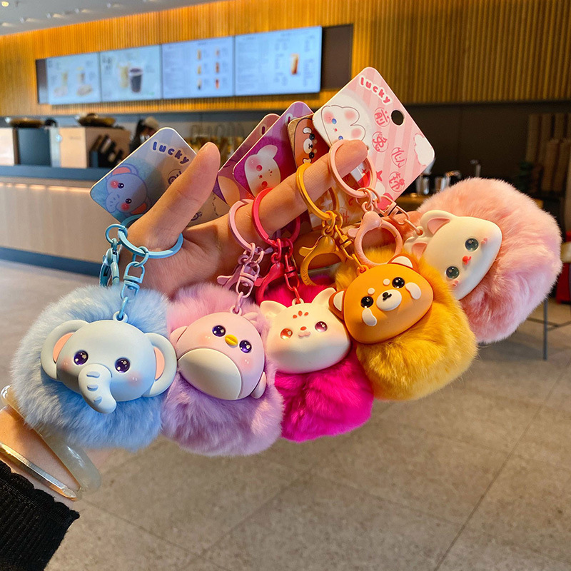 Cute fluffy animal pom pom keychain charms showing multiple designs