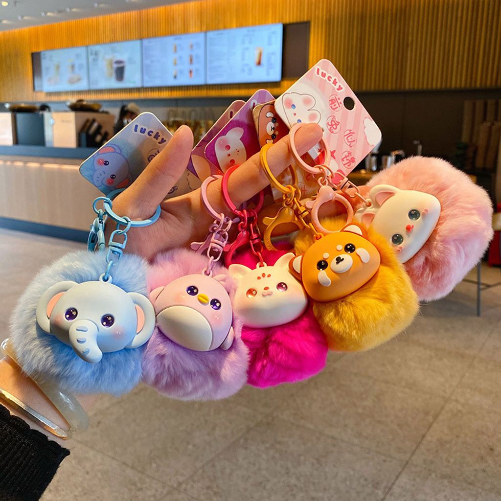Cute fluffy animal pom pom keychain charms showing multiple designs