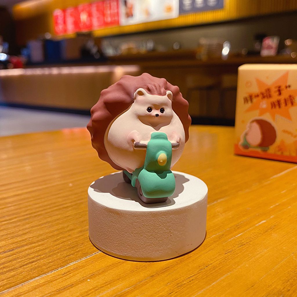 Hedgehog on scooter mini figurine