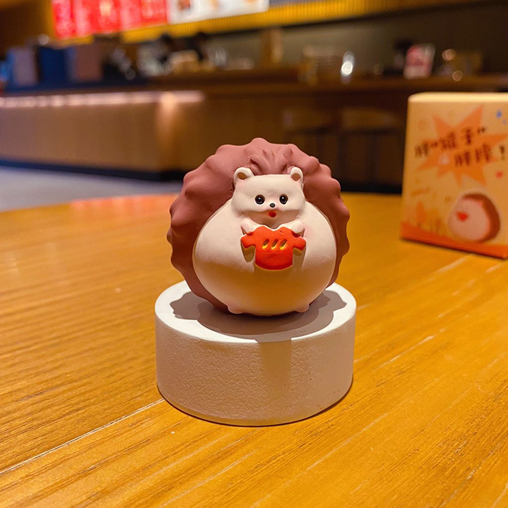 Hedgehog trying on clothes mini figurine