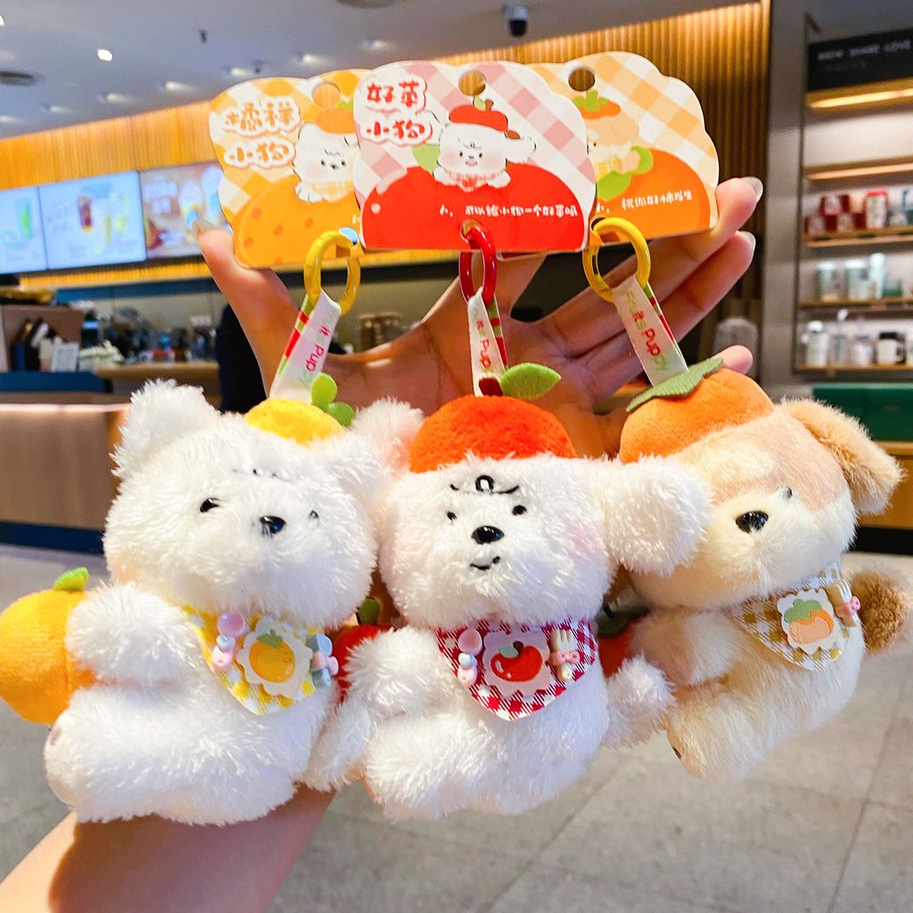 Fruit puppy plush keychain charms featuring orange, apple, and persimmon designs
