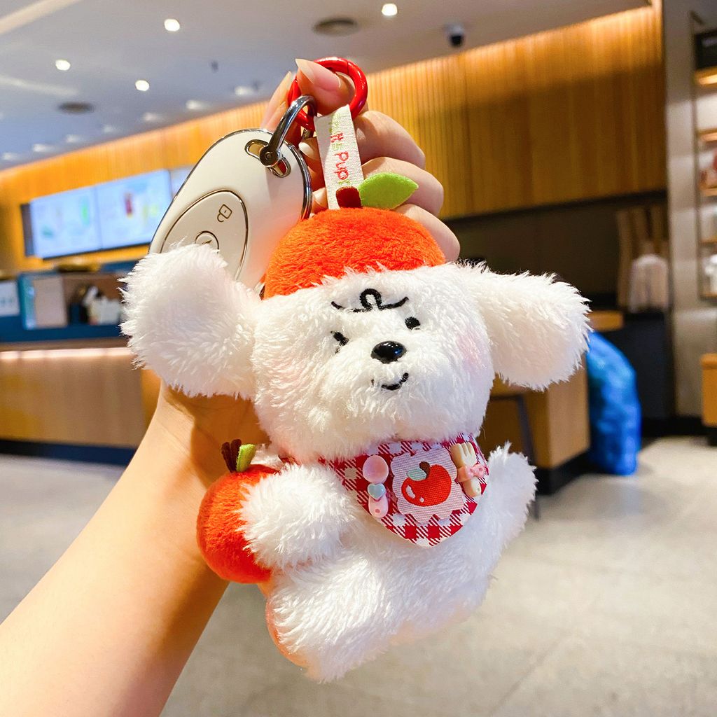 Apple puppy keychain charm attached to car keys
