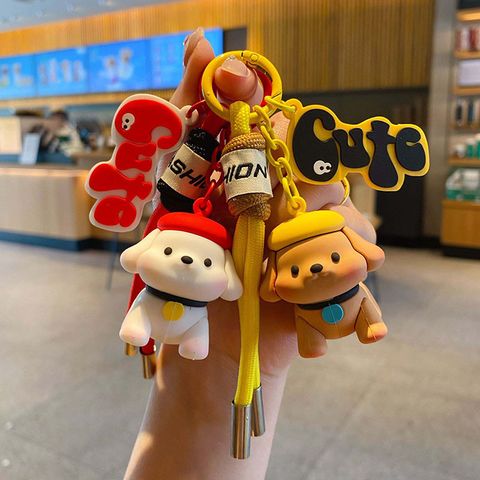 Fun fun puppy keychain charms in red and yellow, featuring cute dog designs with matching straps.