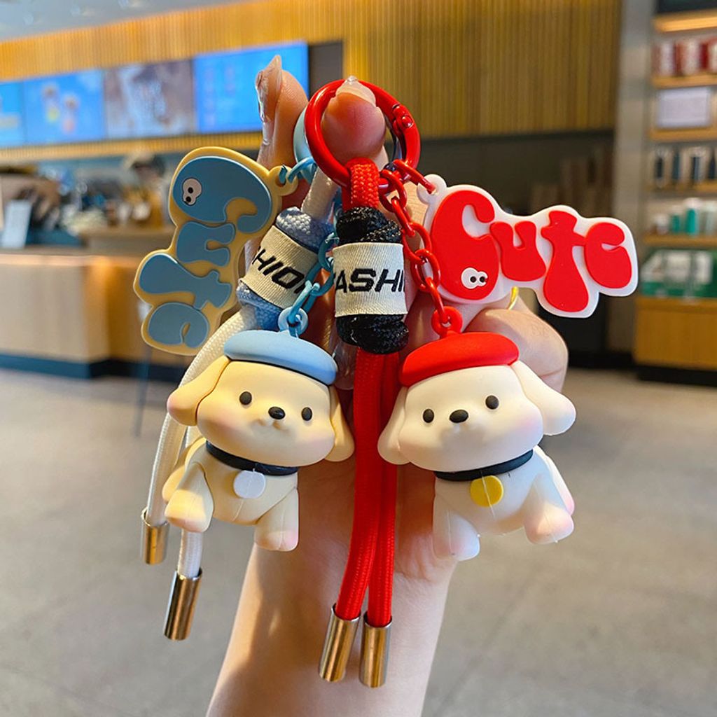 Fun fun puppy keychain charms in blue and red, featuring cute dog designs with matching straps.