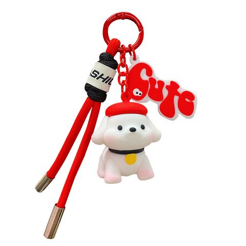 Fun fun puppy keychain charm in red on white background