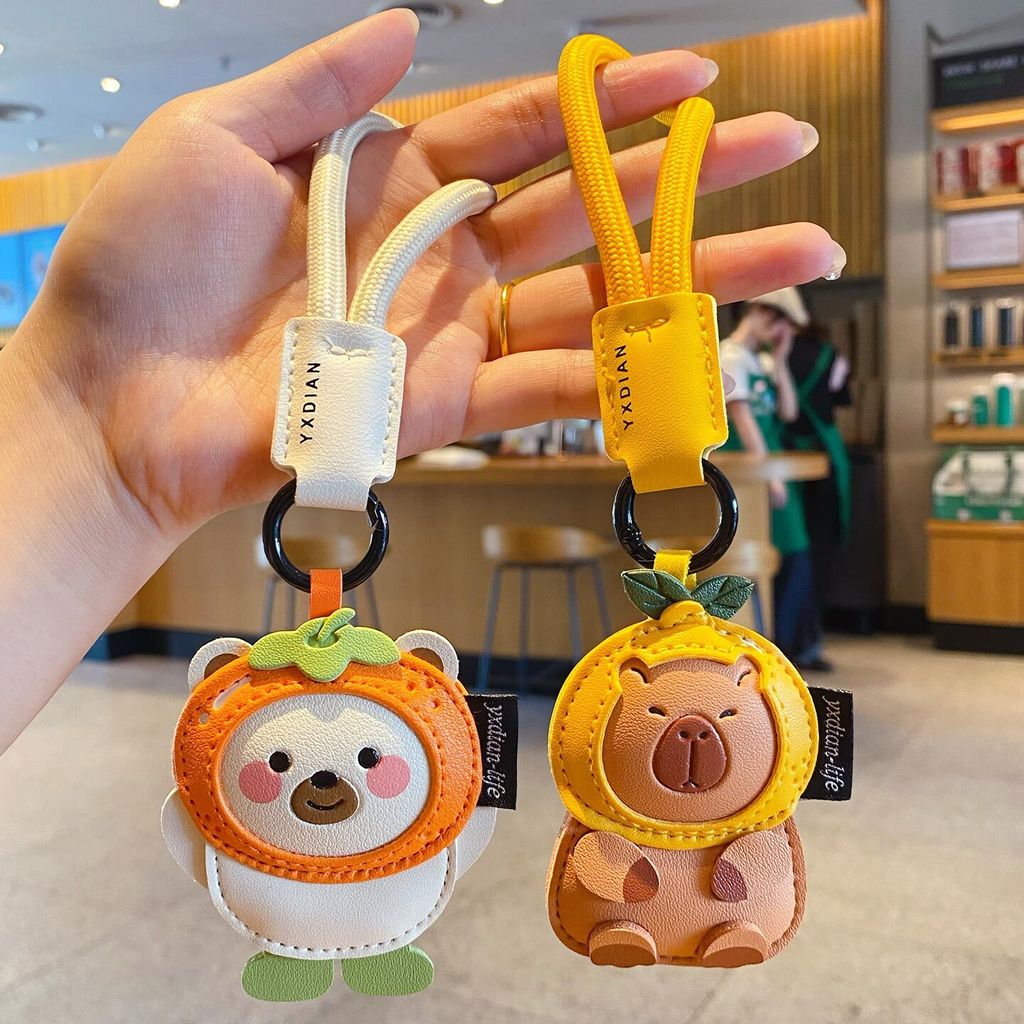 Cute leather animal keychain charms featuring a polar bear and a capybara