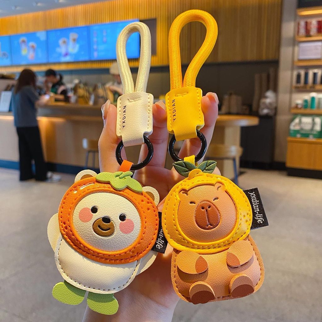 Cute leather animal keychain charms featuring a polar bear and a capybara