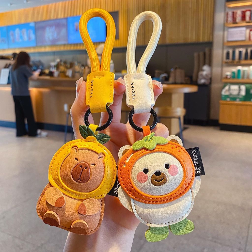 Cute leather animal keychain charms featuring a capybara and a polar bear
