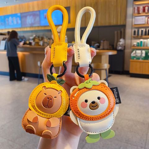 Cute leather animal keychain charms featuring a capybara and a polar bear