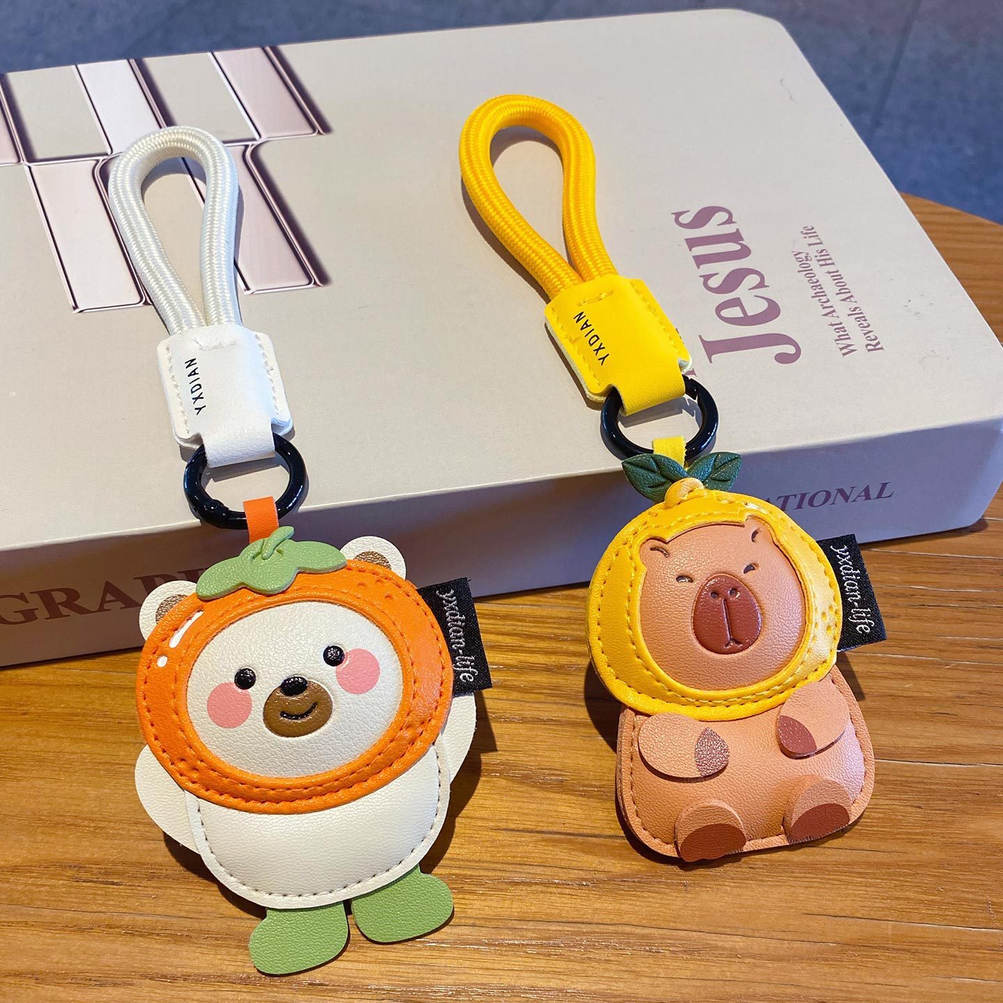 Cute leather animal keychain charms featuring a polar bear and a capybara