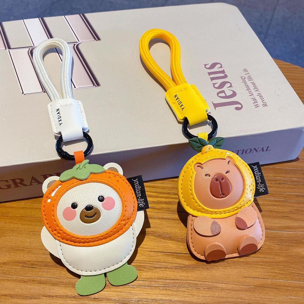 Cute leather animal keychain charms featuring a polar bear and a capybara