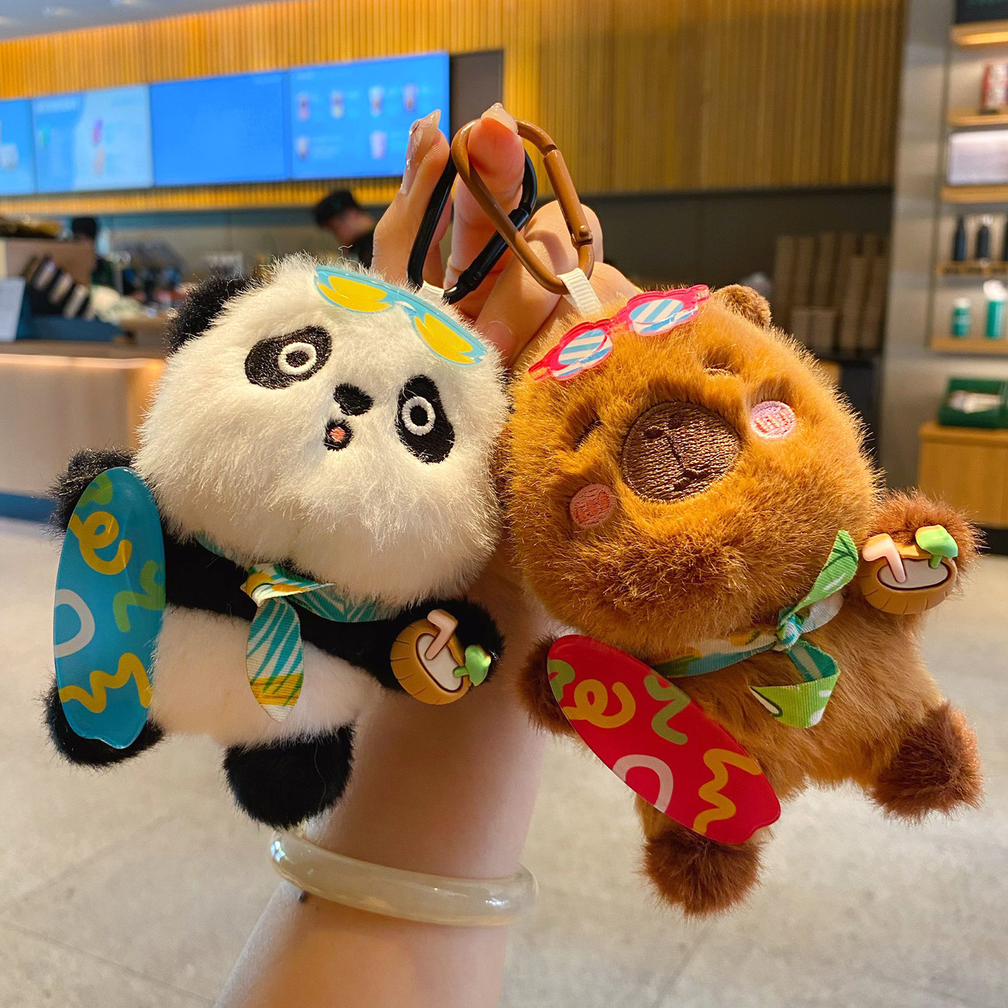 Panda and capybara plush skateboard keychain charms