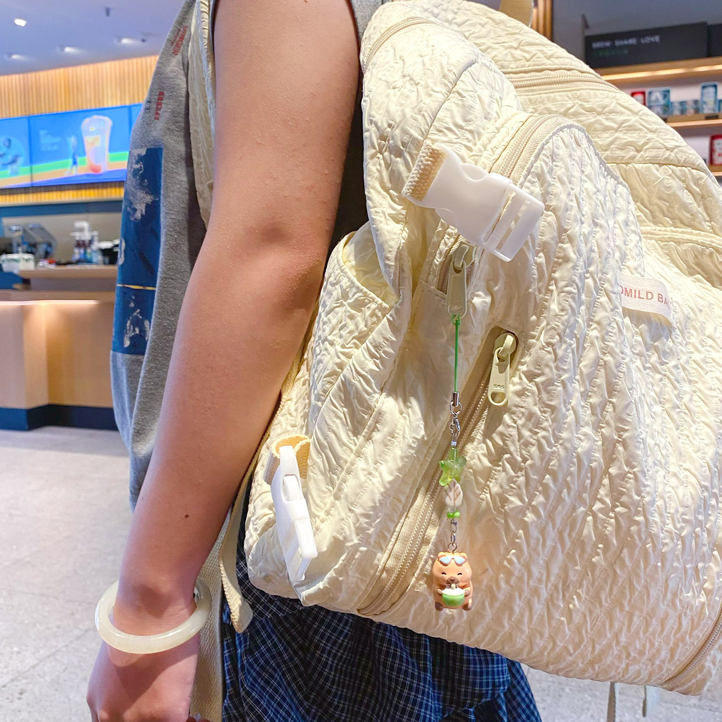 Beach capybara beaded keychain charm hanging on a bag