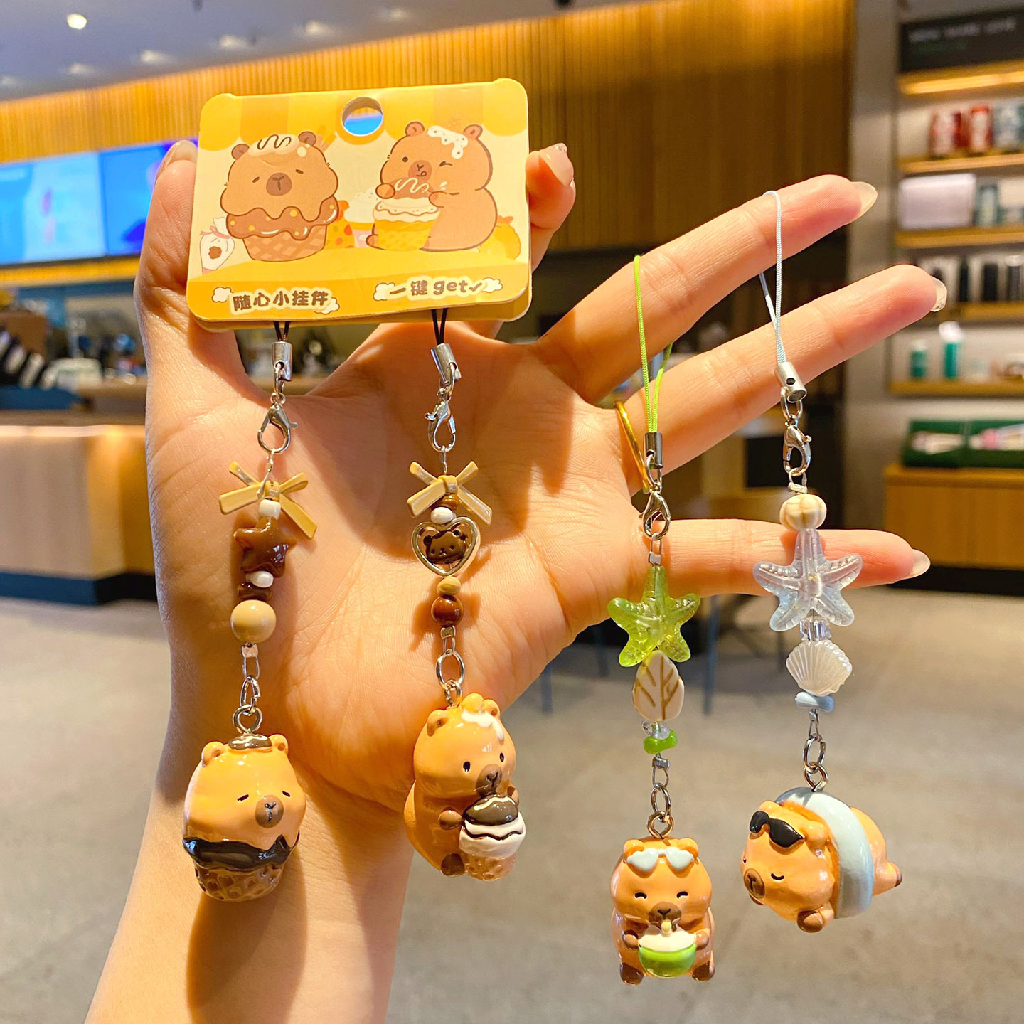 Beach capybara and dessert capybara beaded keychain charm pairs