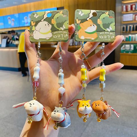 Bichon Frise and Schnauzer puppy keychain charm pair, and Shiba Inu and Teddy Poodle puppy keychain charm pair