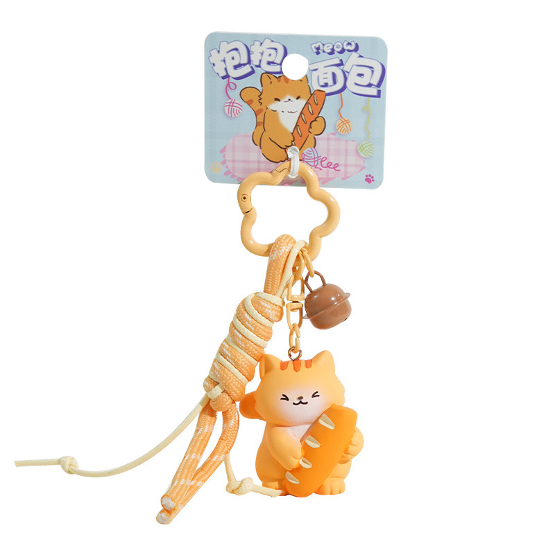 Cute bread cat keychain charm on white background