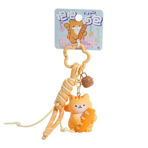 Cute bread cat keychain charm on white background