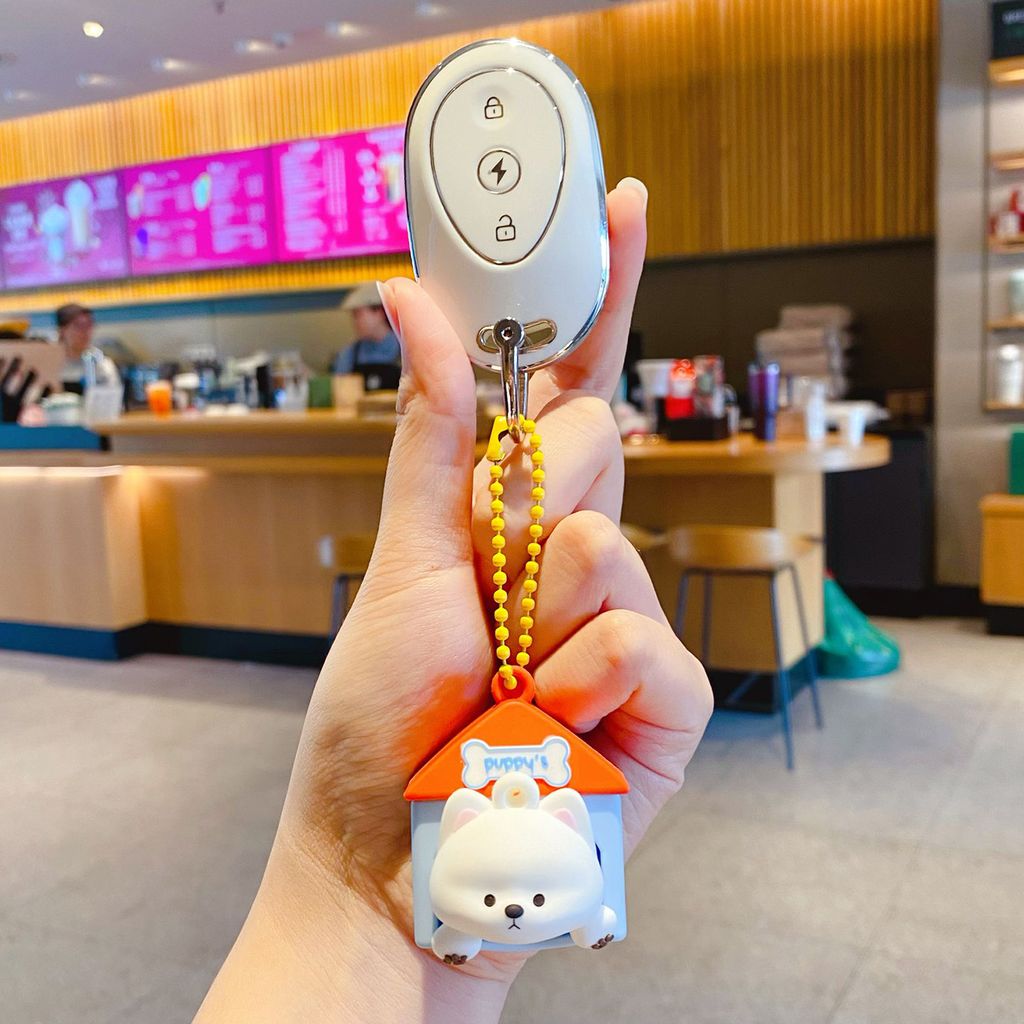 Cute Westie puppy house keychain charm attached to a car key fob