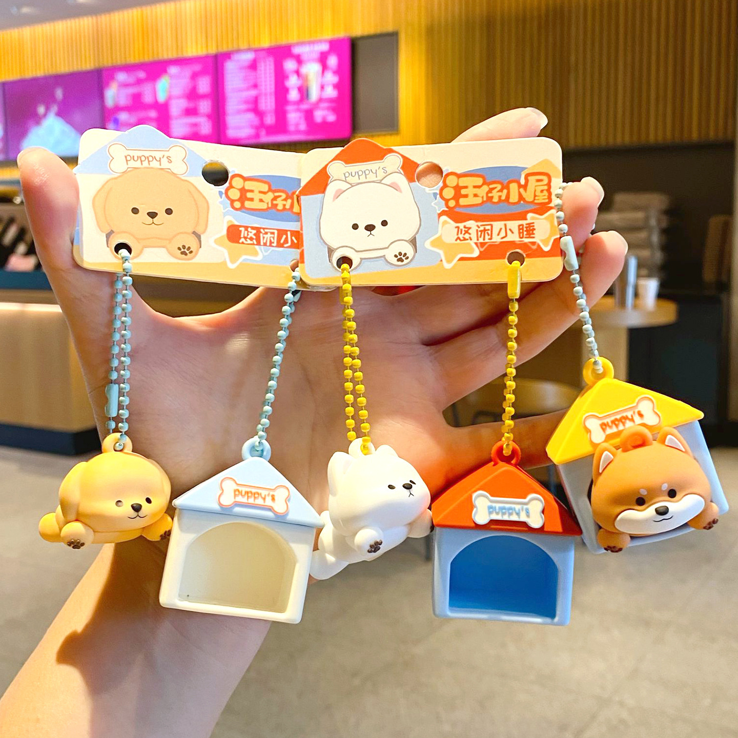 Cute puppy house keychain charms showing multiple dog designs