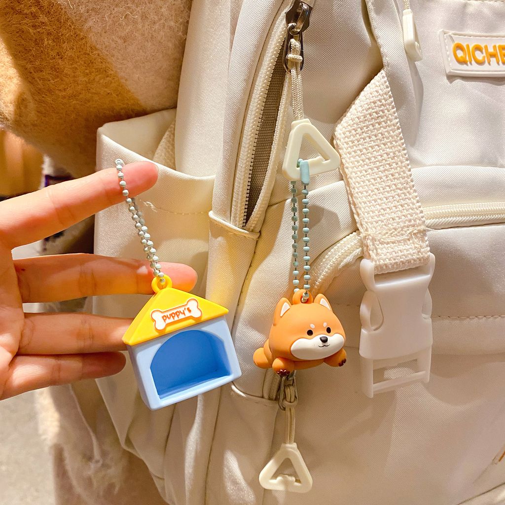 Cute Shiba Inu puppy house keychain charm hanging on a bag