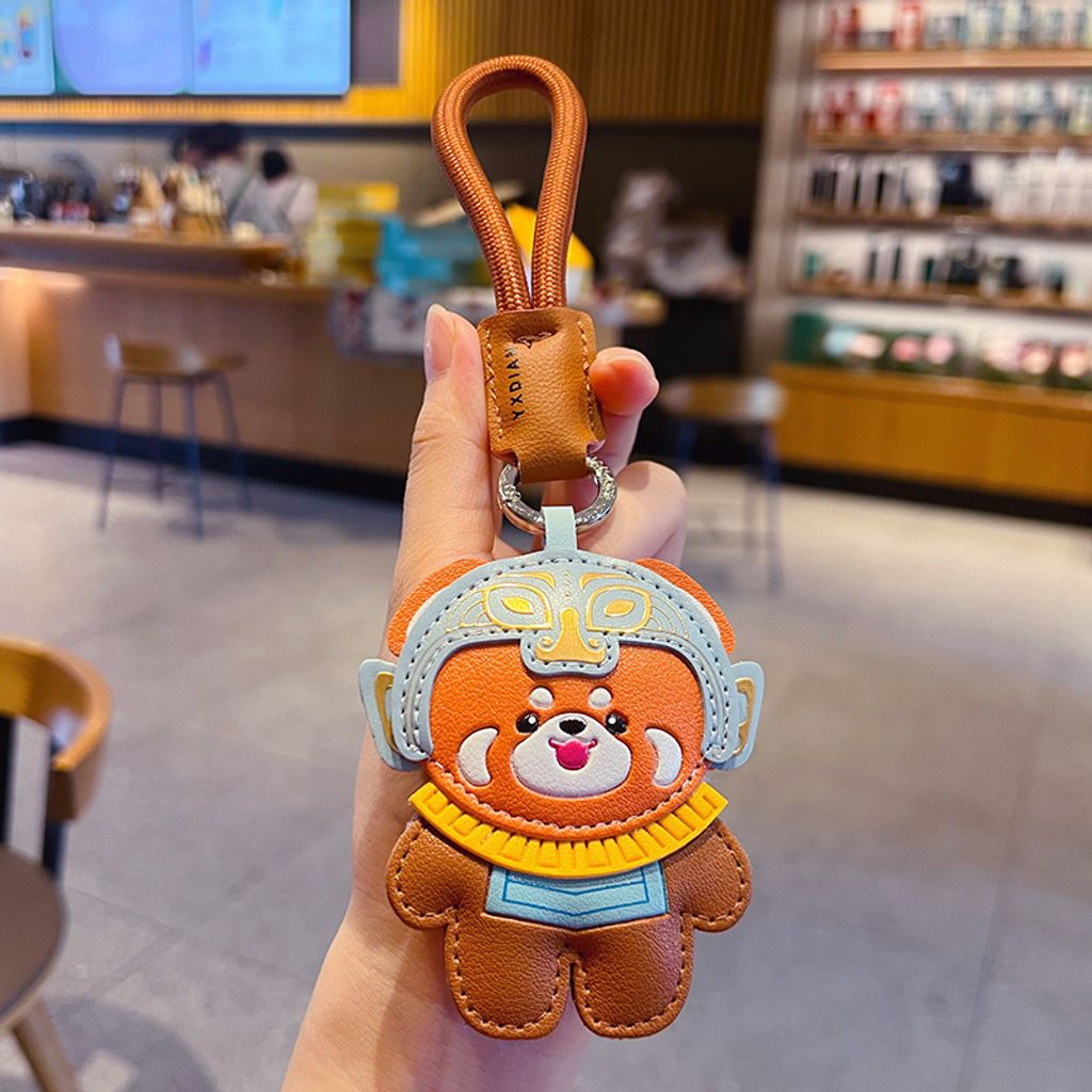 Red panda leather keychain charm with Sanxingdui mask design